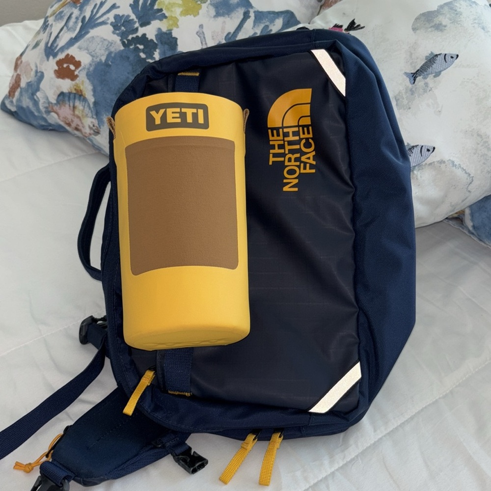 North Face LIKE NEW voyager sling and NWT yeti bottle sling (lg) w/ strap bundle